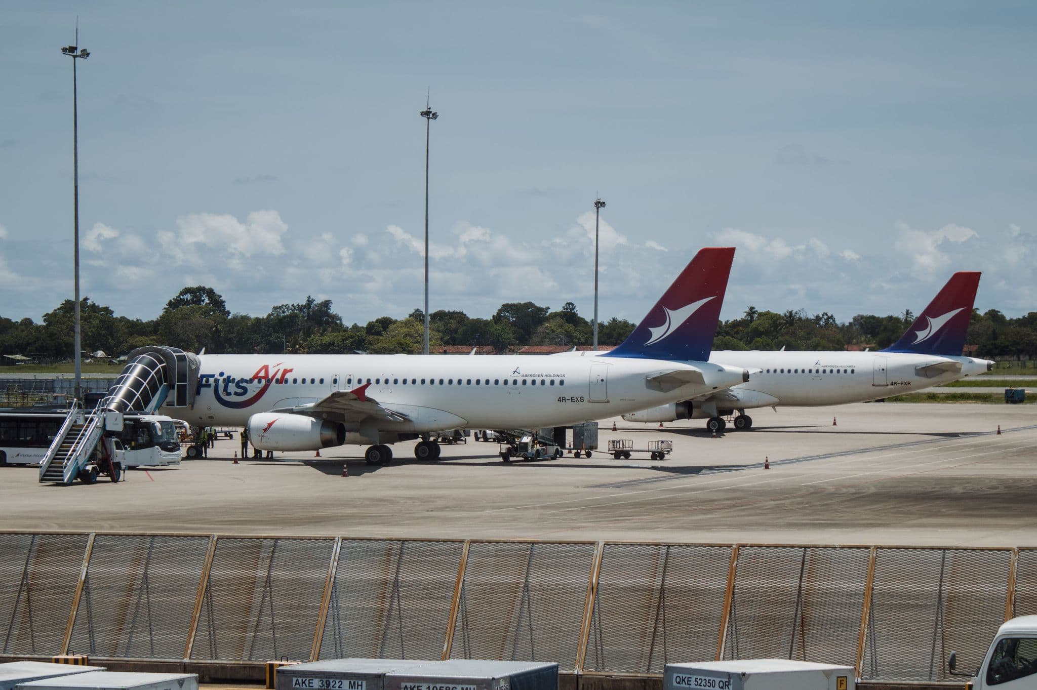 Two FitsAir Airbus A320s parked on the apron at Colombo Bandaranaike International Airport