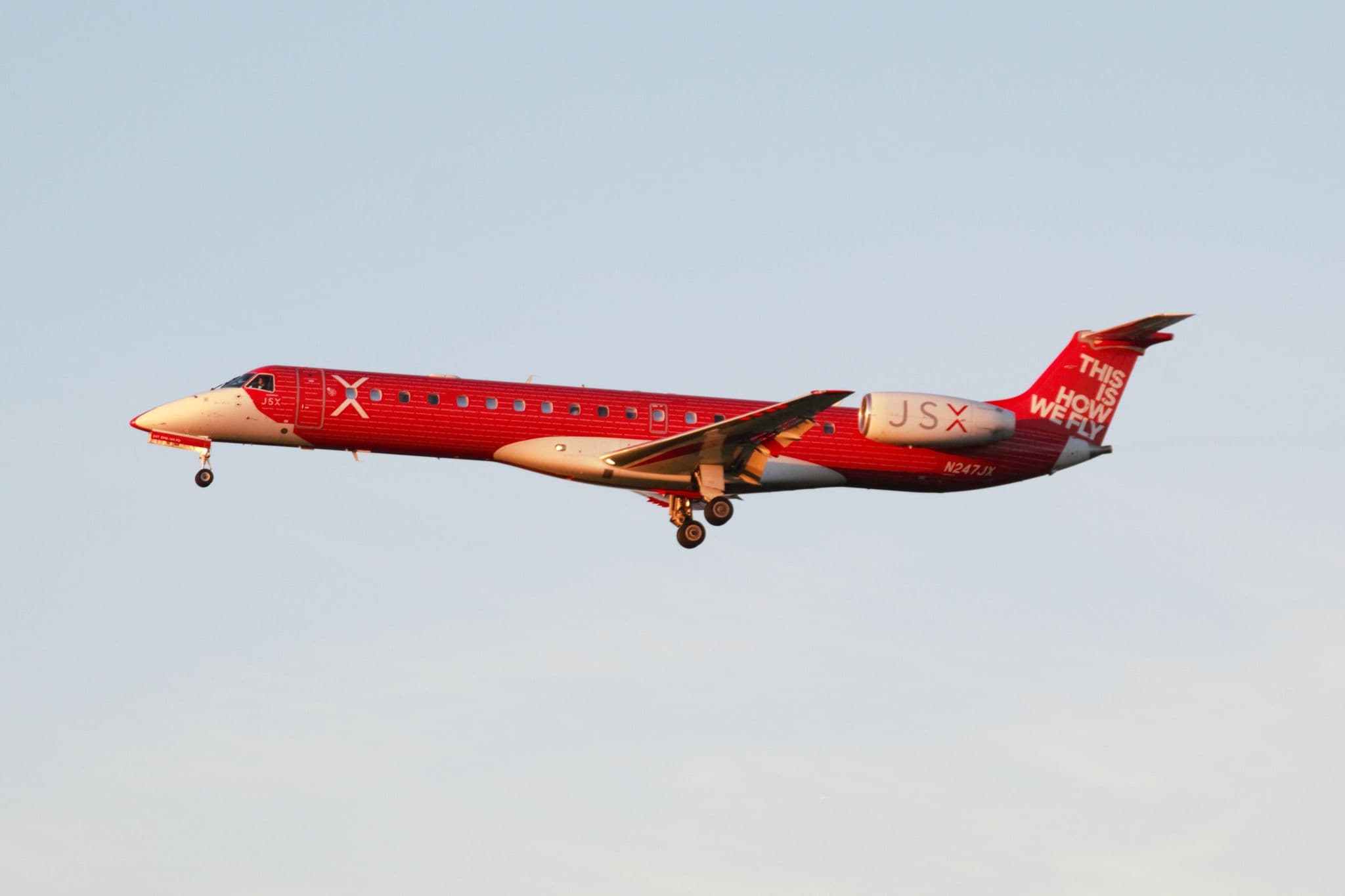 JSX Embraer ERJ-145LR N247JX in red This Is How We Fly livery on approach to Los Angeles International Airport