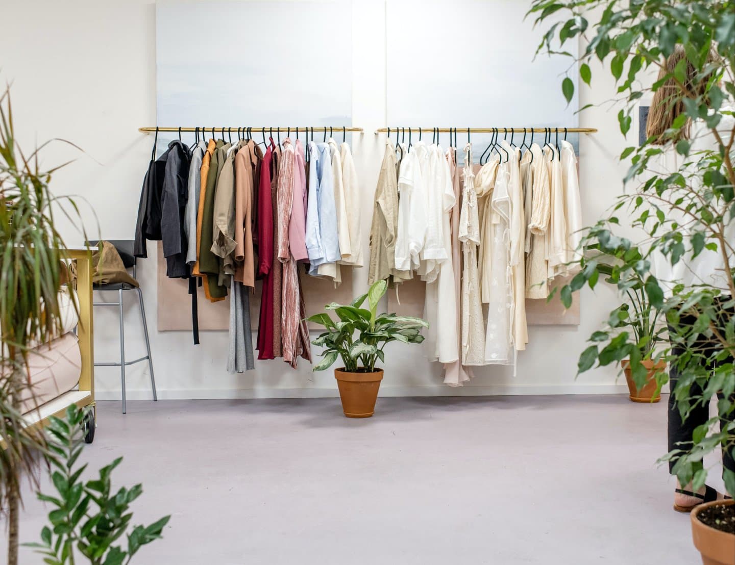 Clothing rails inside a retail store that accepts Atome
