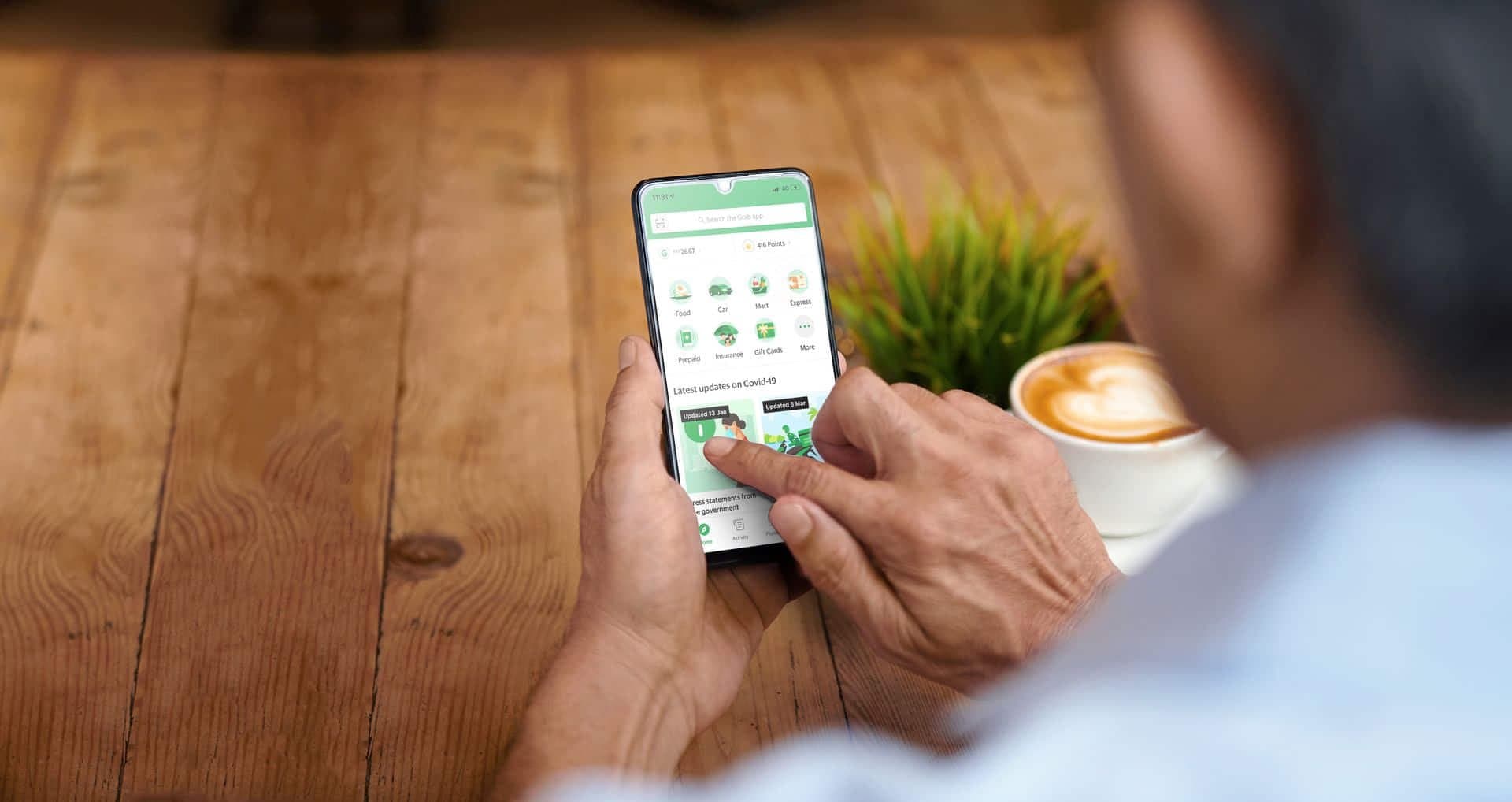 Person using the Grab app on a phone