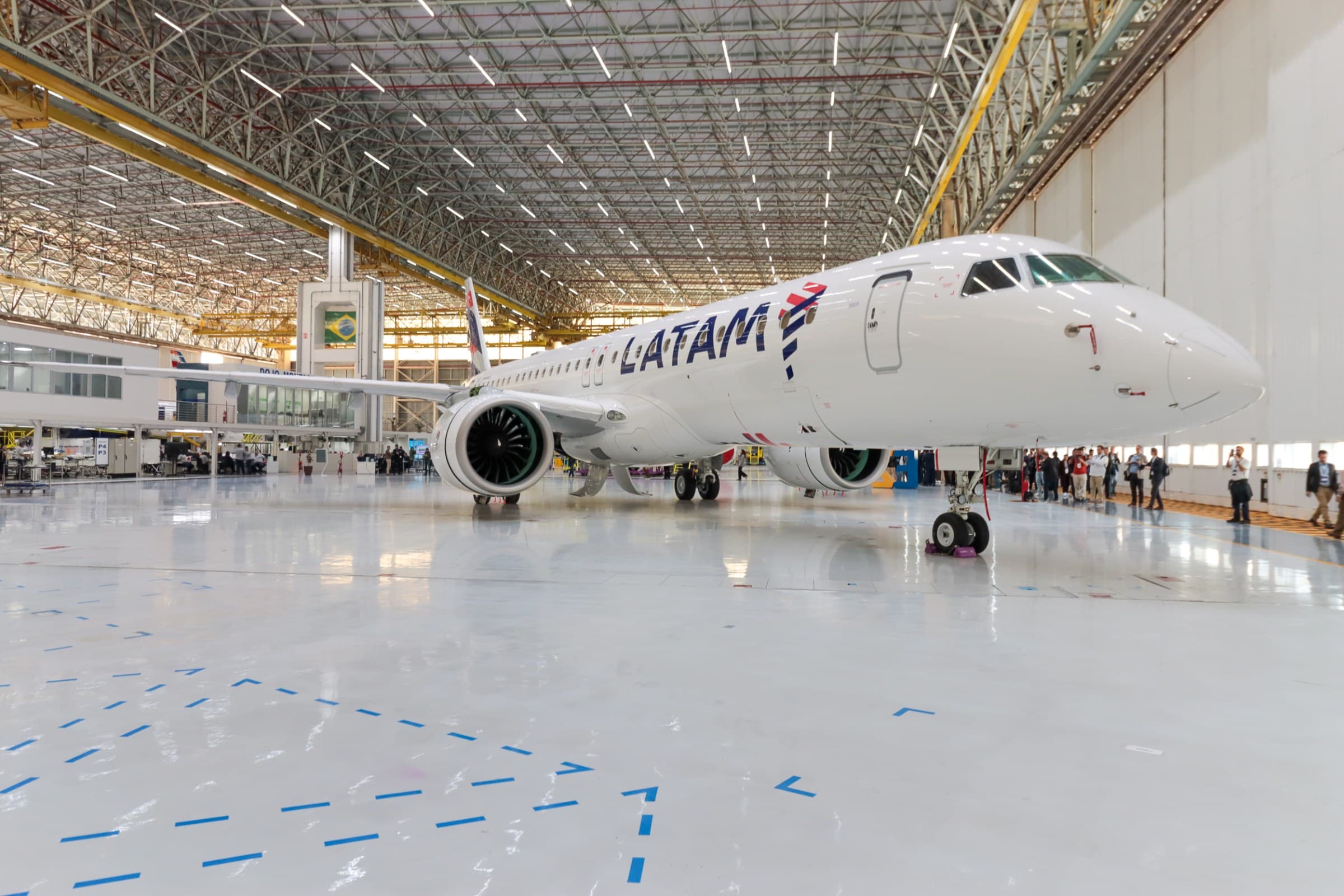 LATAM Airlines Embraer E195-E2 aircraft parked in a hangar
