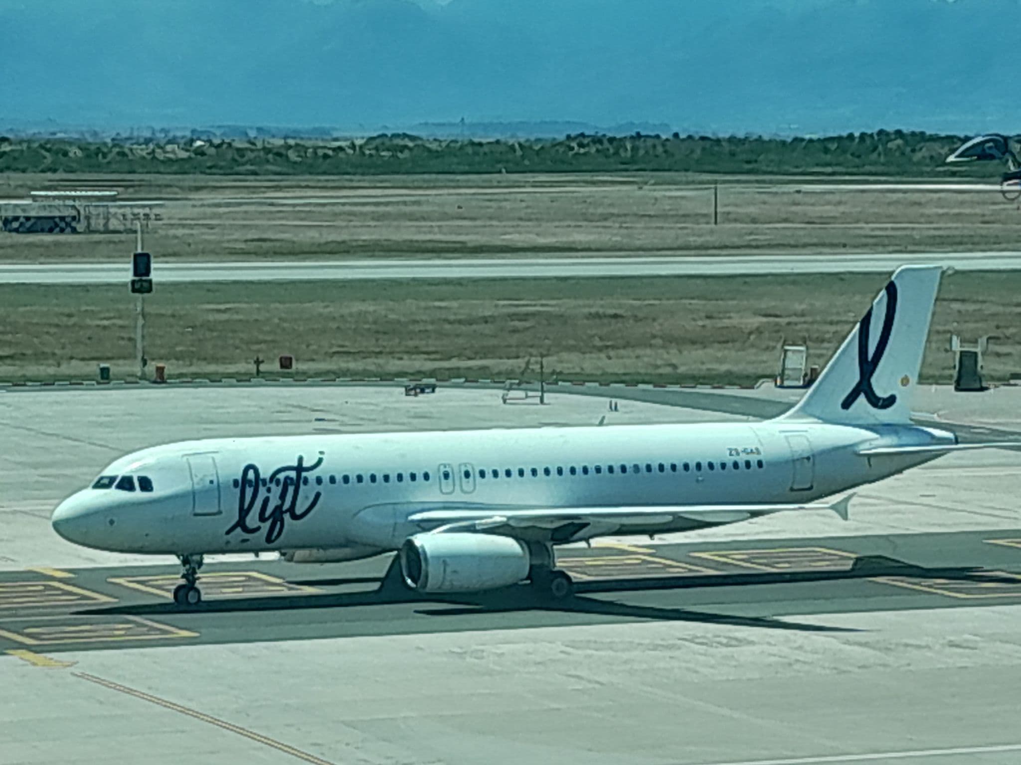 LIFT Airbus A320 ZS-GAS on the apron in LIFT's white livery