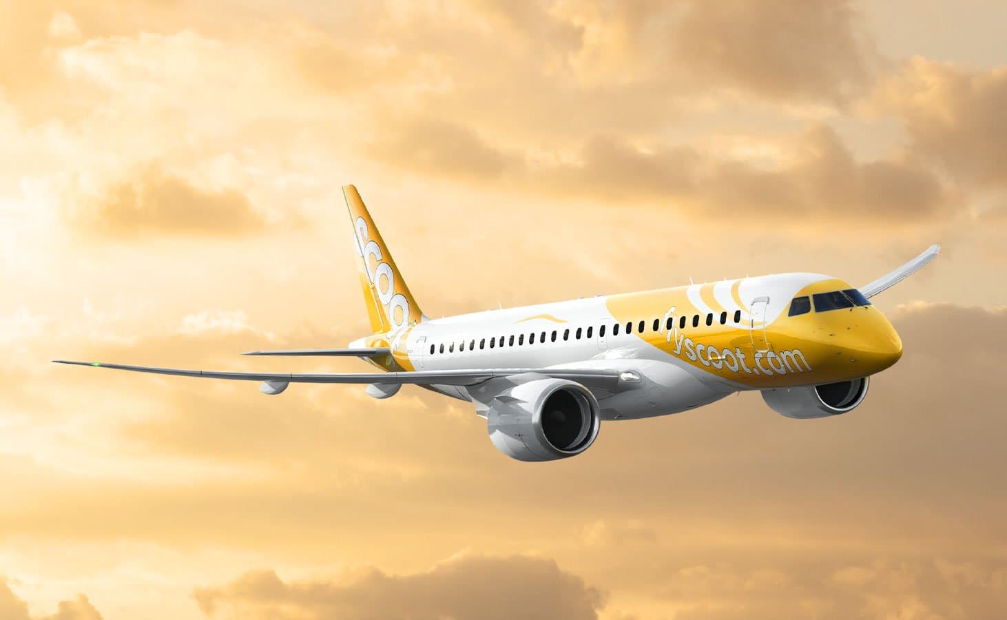 Scoot Embraer E190-E2 aircraft in flight at sunset