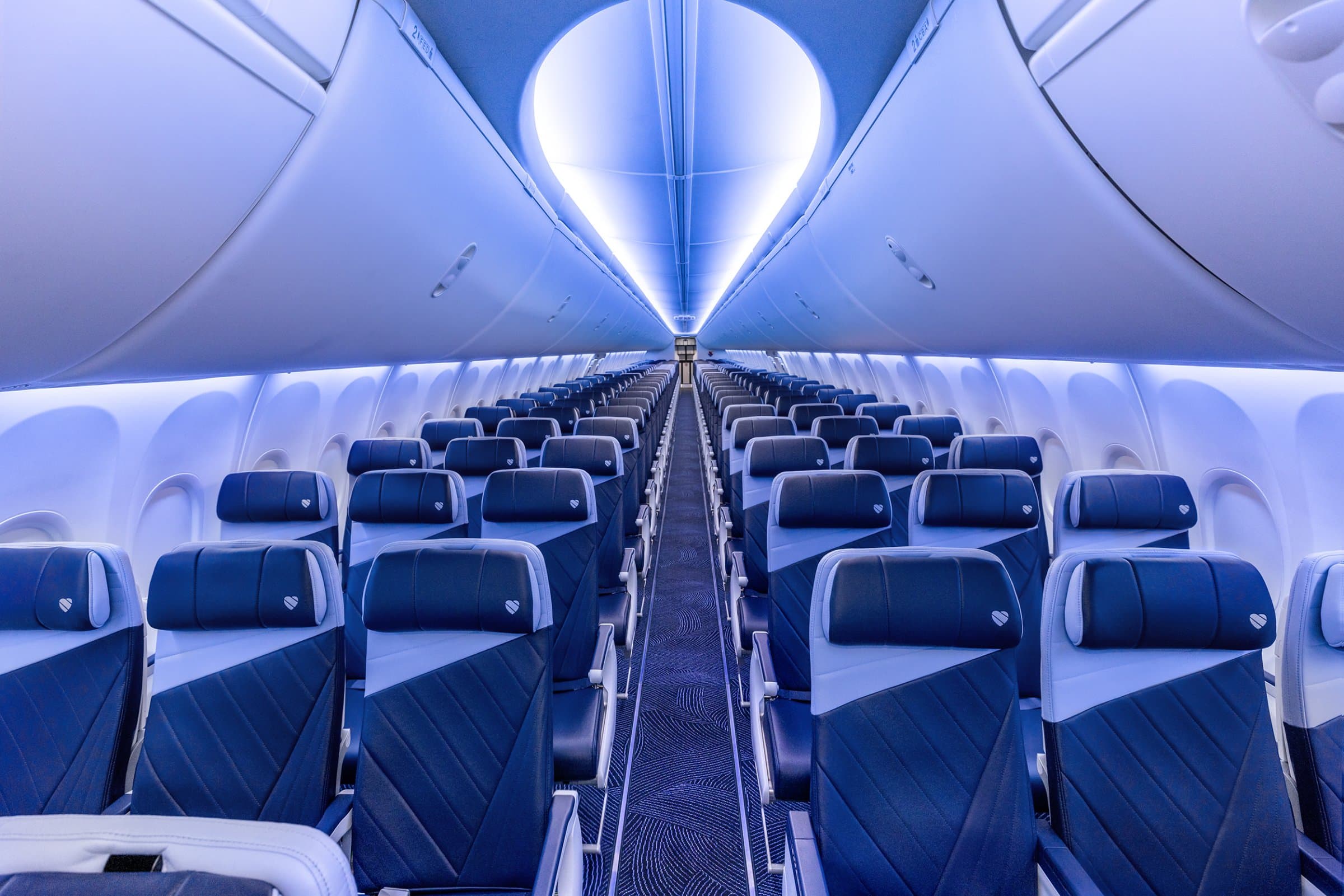 Southwest Airlines cabin aisle with rows of blue seats