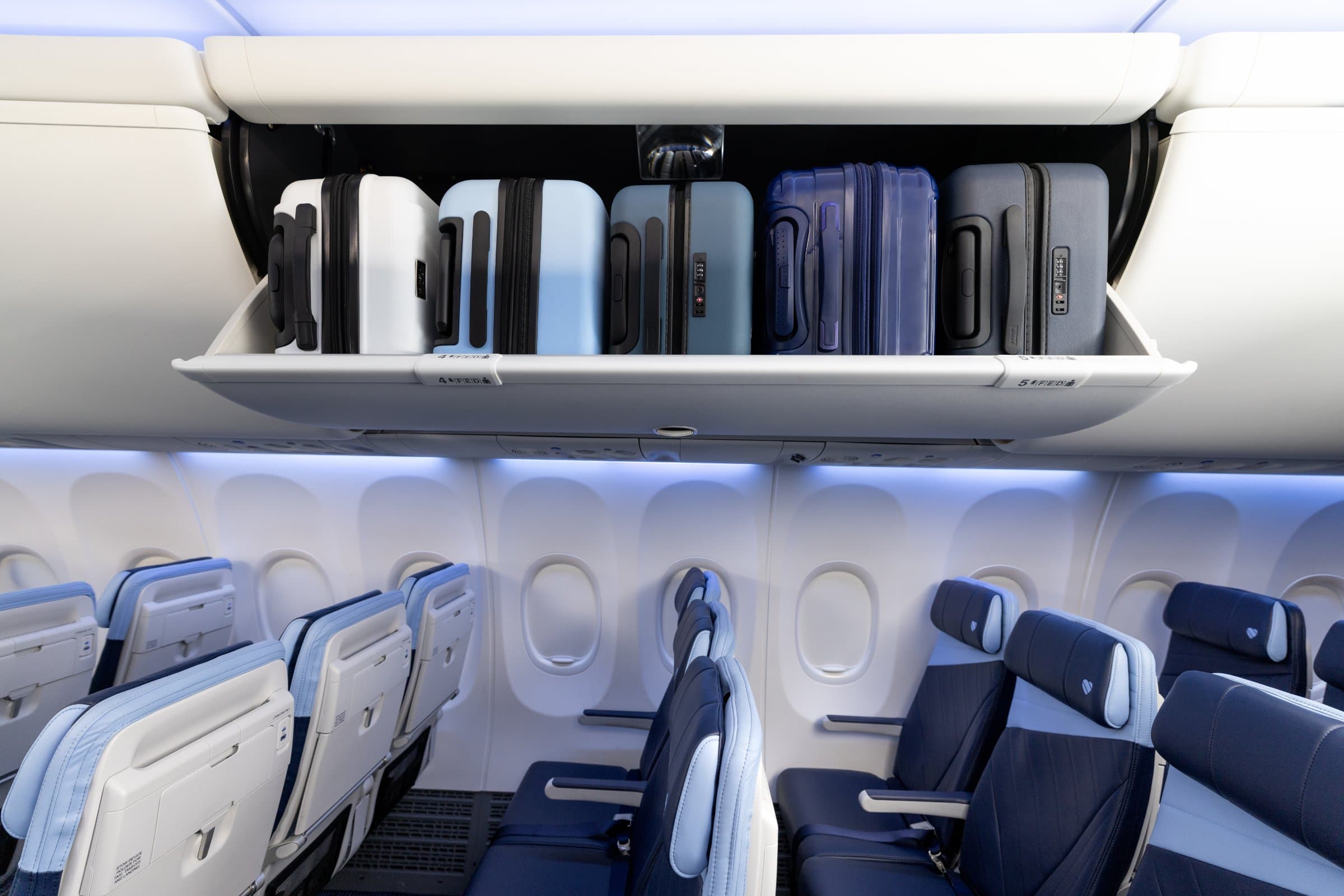 Open overhead bins above Southwest Airlines cabin seats