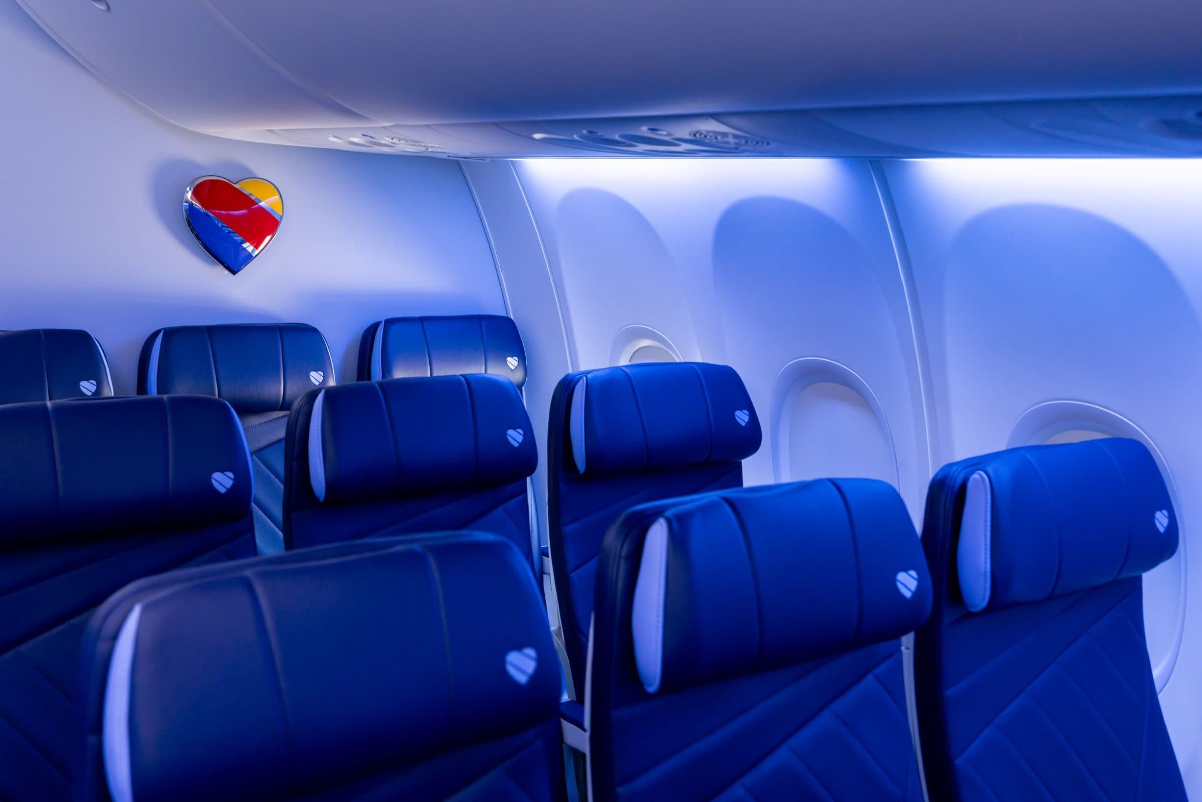Southwest Airlines cabin seats with the heart logo on the bulkhead
