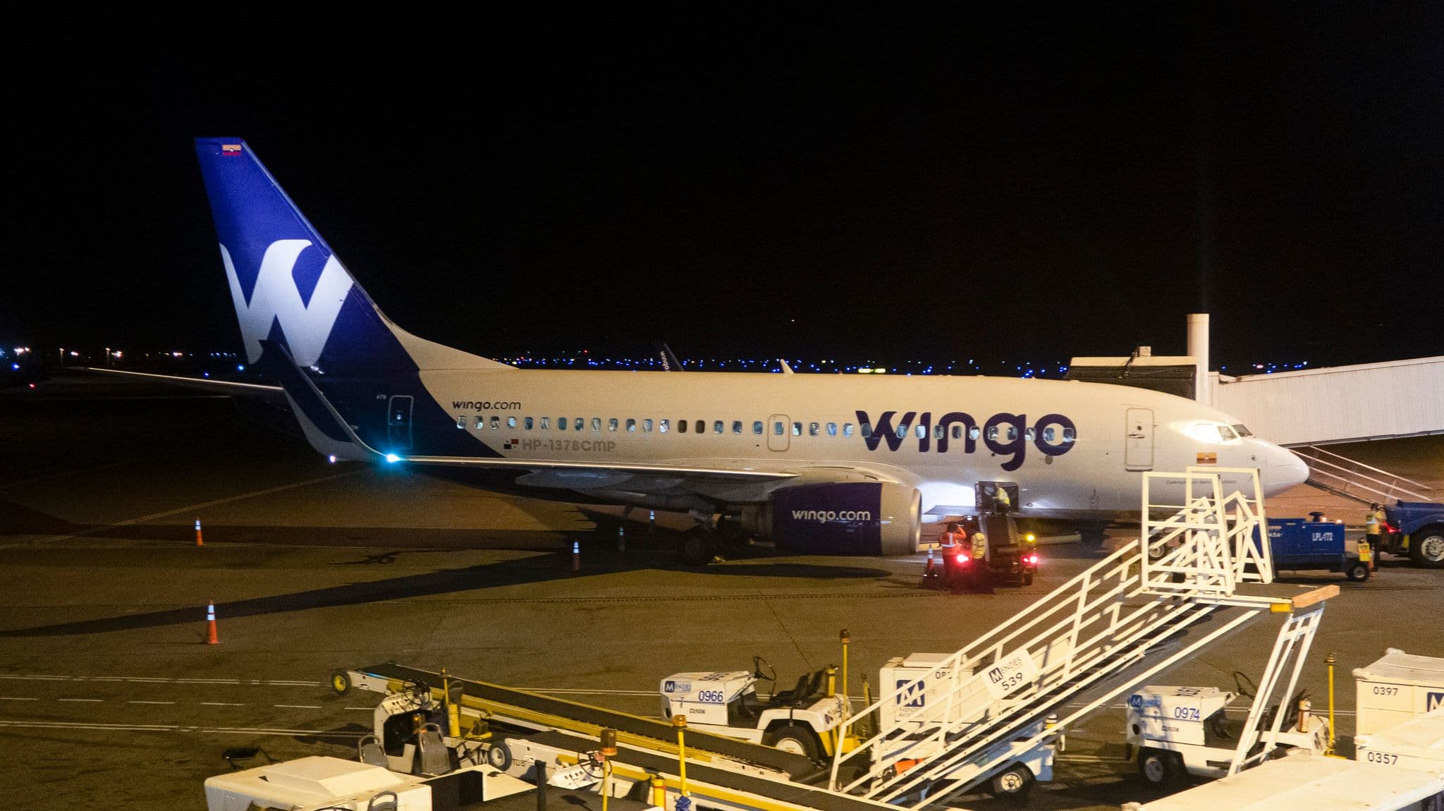 Wingo Boeing 737-700 at the gate at Cali airport at night