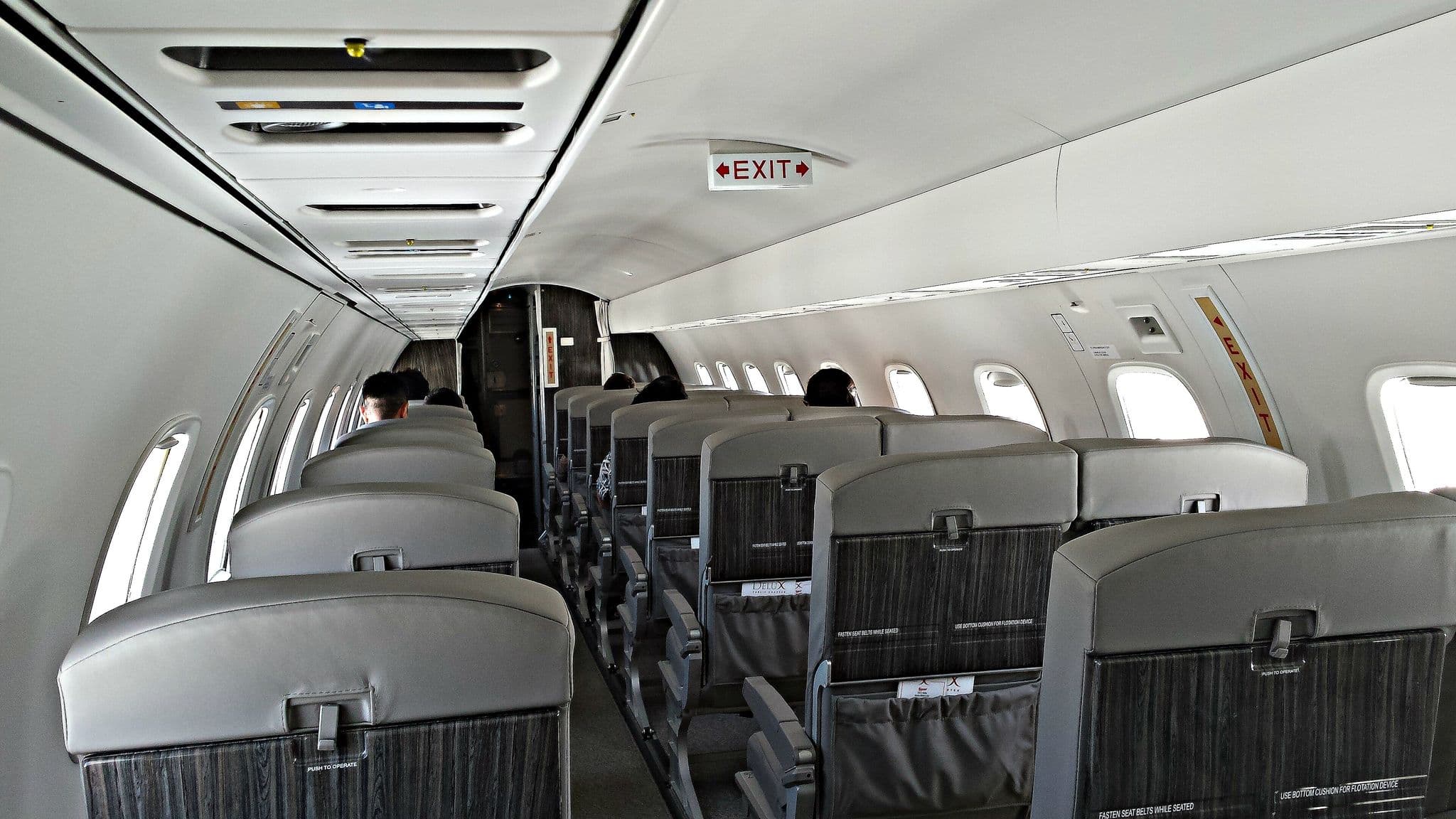 Leather seats in the cabin of a JetSuiteX Embraer ERJ-135, N719AE