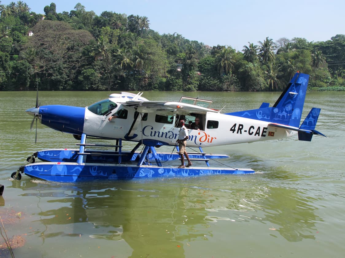 Cinnamon Air Cessna 208 Caravan seaplane moored on Polgolla Reservoir, Sri Lanka