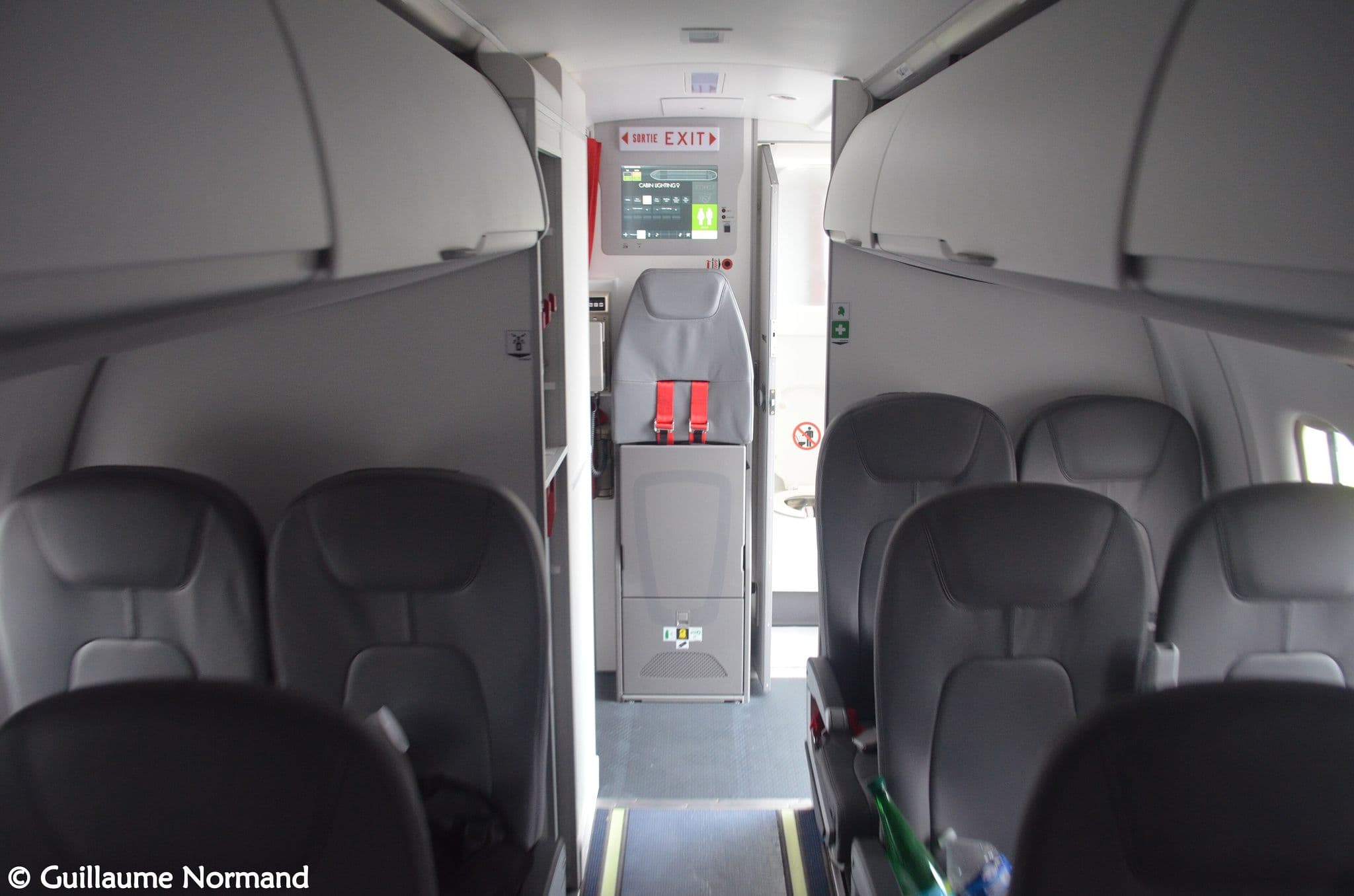 Leather seats and aisle inside the cabin of an Air Antilles ATR 42-500