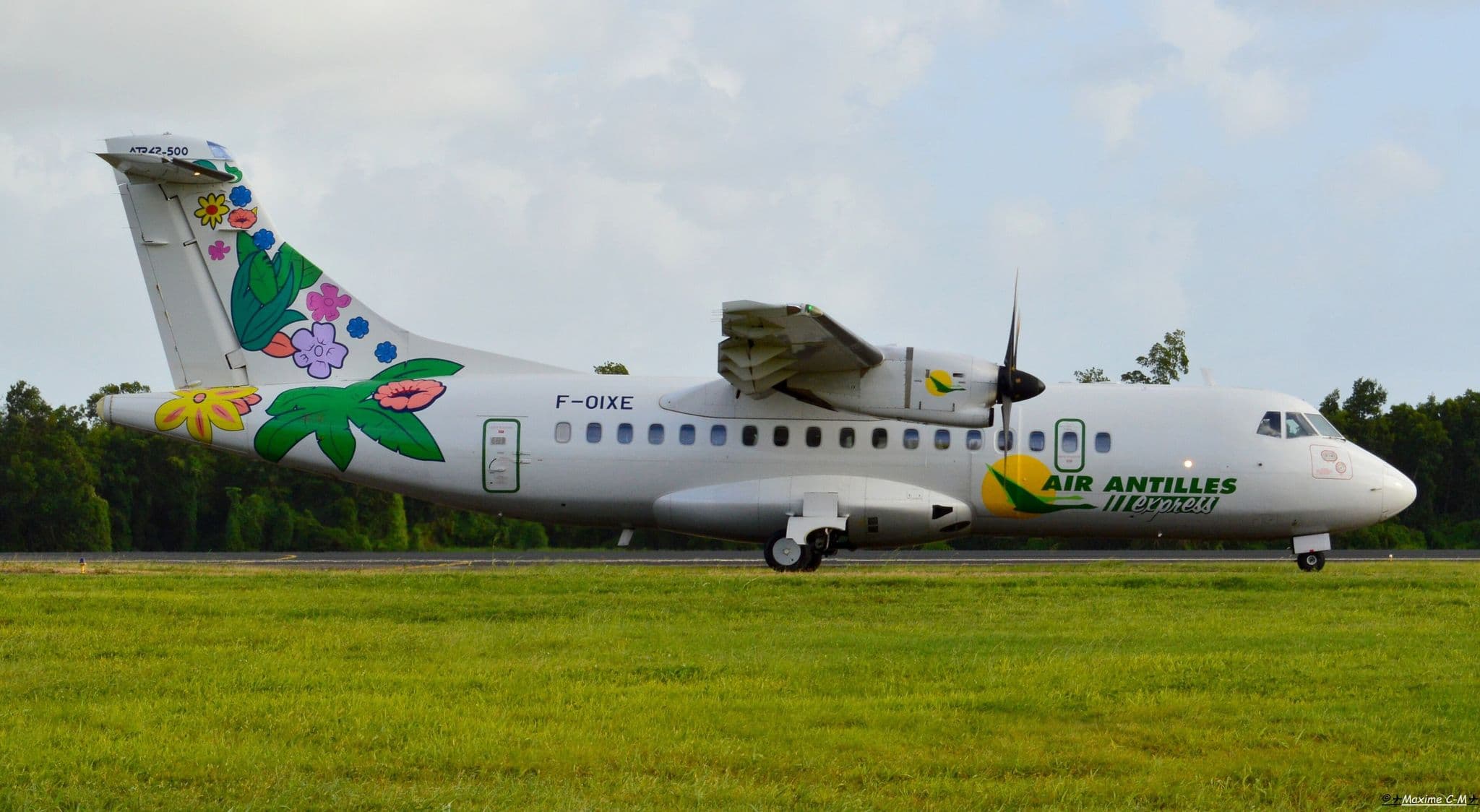 Air Antilles Express ATR 42-500 F-OIXE rolling along a grass-lined runway