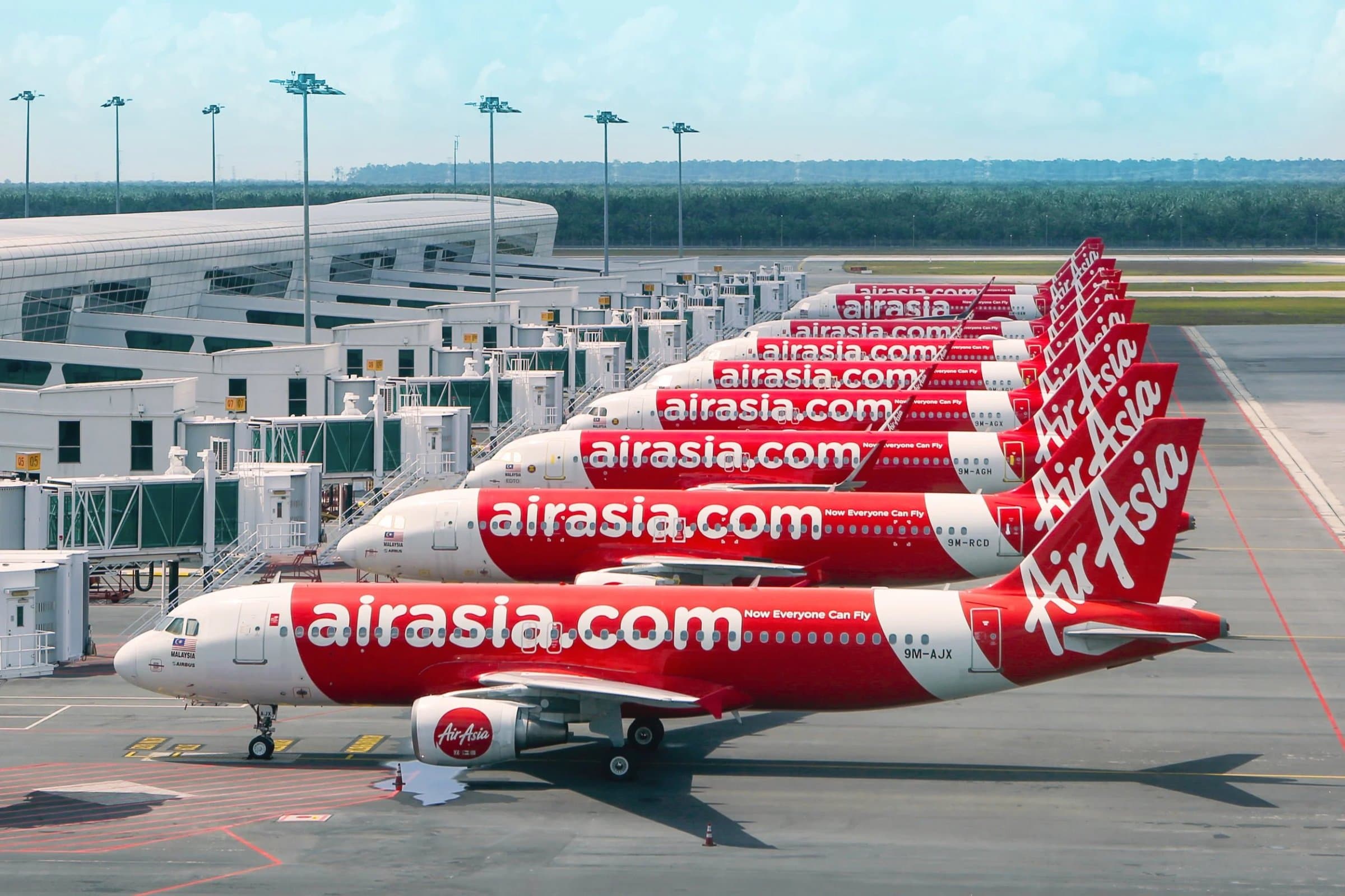 AirAsia aircraft lined up at an airport terminal