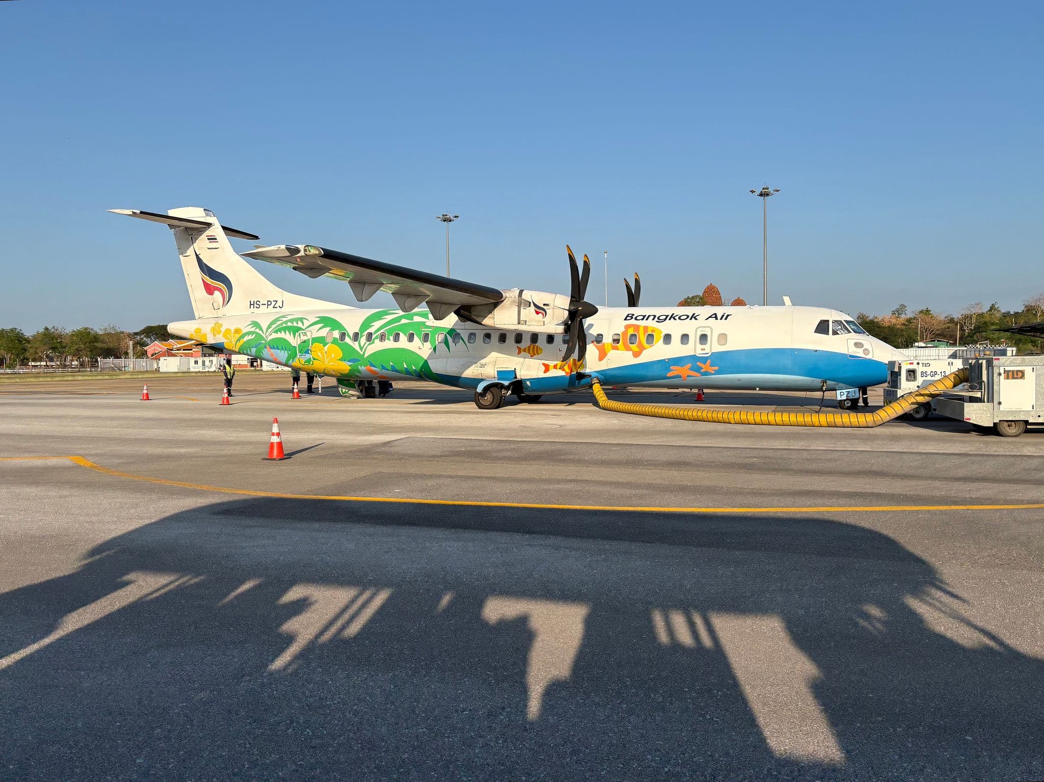 Bangkok Airways ATR 72-600 (HS-PZJ) in tropical livery on the apron at Sukhothai Airport