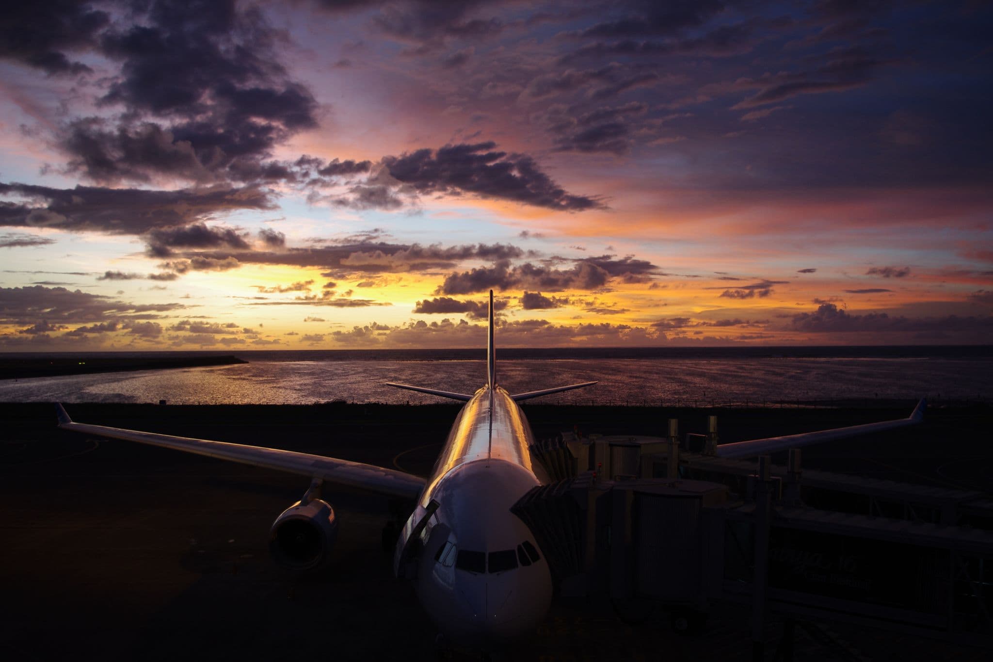 Garuda Indonesia Airbus A330 on the apron at Bali Denpasar airport at sunset