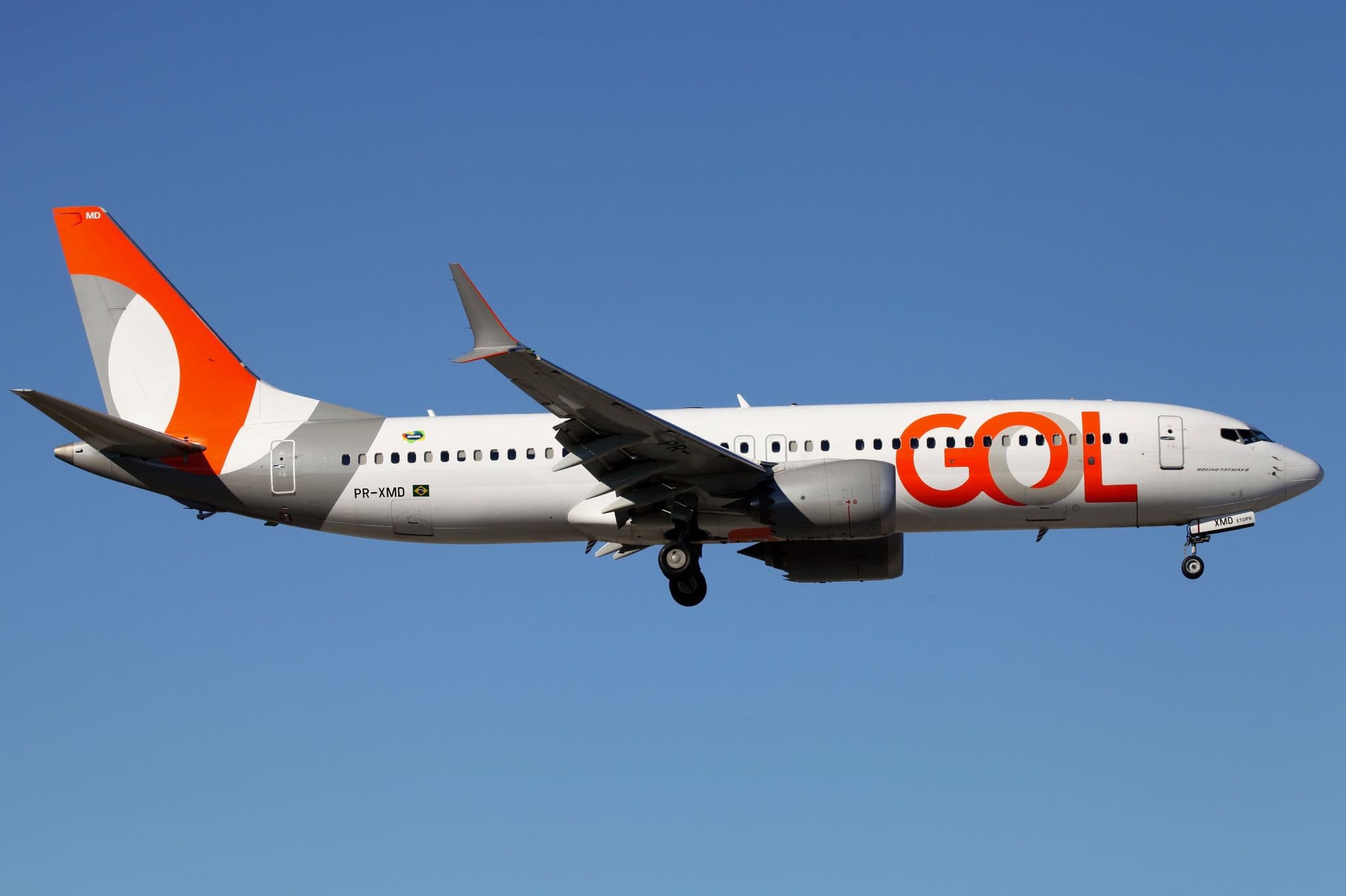 GOL Boeing 737 MAX 8 PR-XMD in flight against a blue sky near Miami