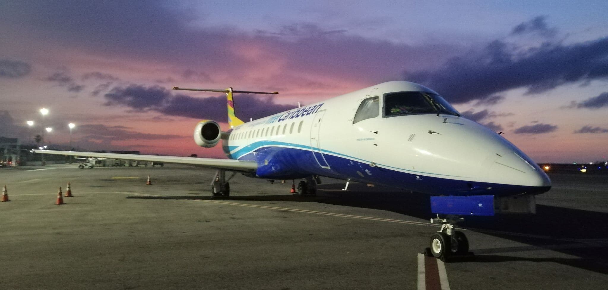 InterCaribbean Airways Embraer 145 on the apron at Montego Bay at dusk