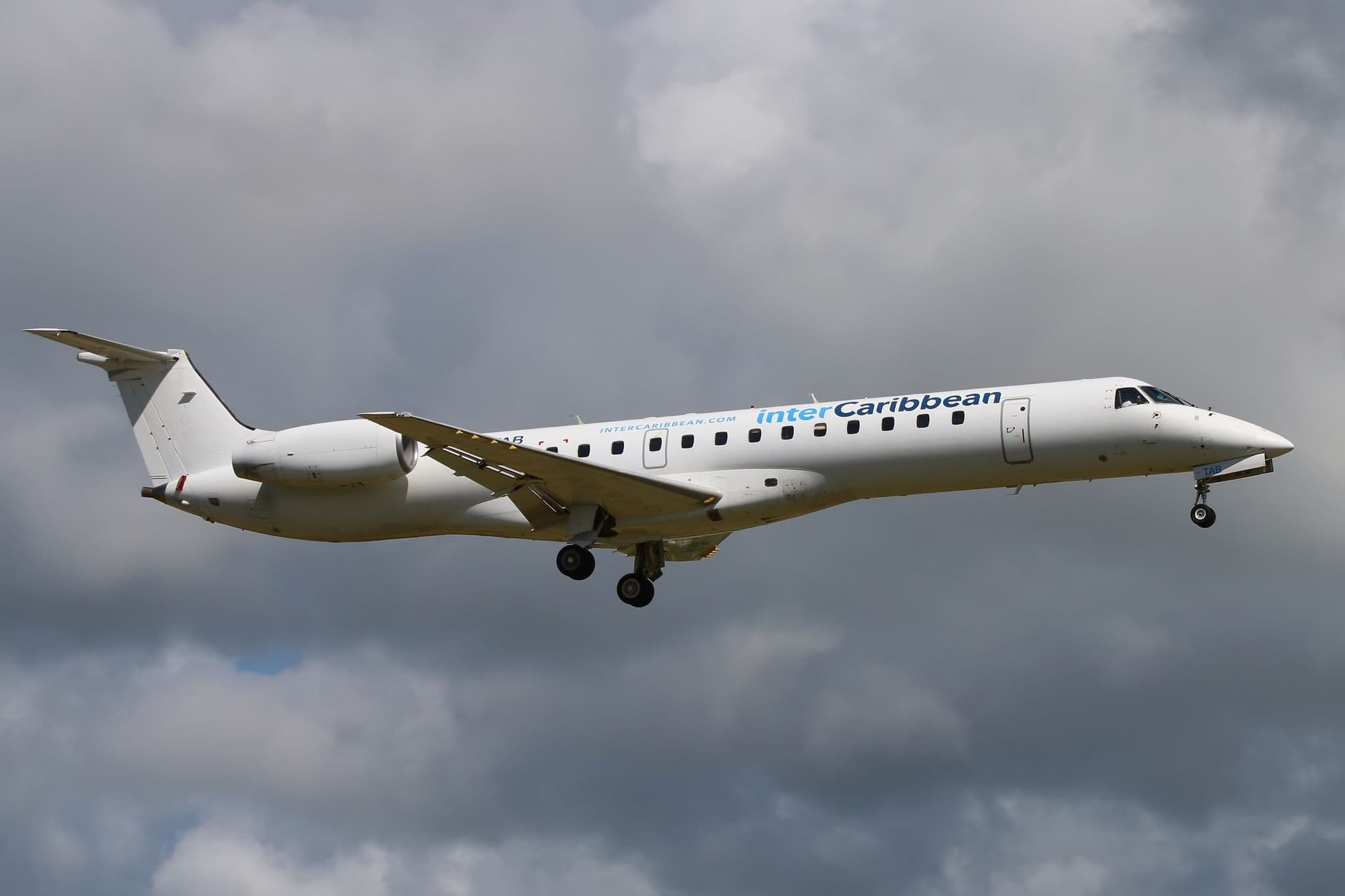 InterCaribbean Airways Embraer ERJ-145LR VQ-TAB on approach to Barbados under cloudy skies