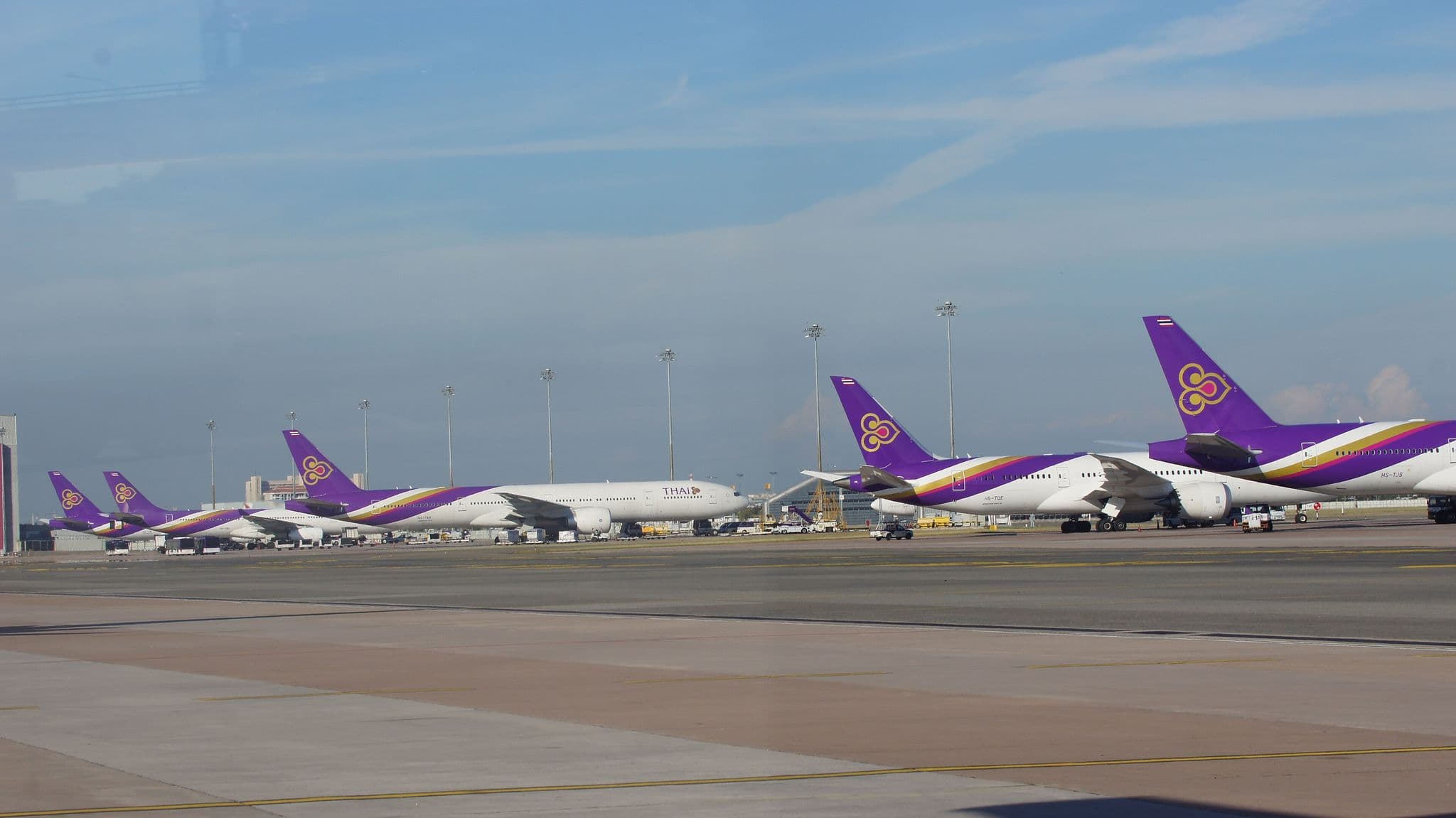 Row of Thai Airways widebody aircraft parked at Bangkok Suvarnabhumi Airport